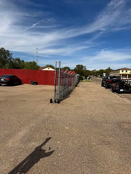 Cleaned lot beside a fence