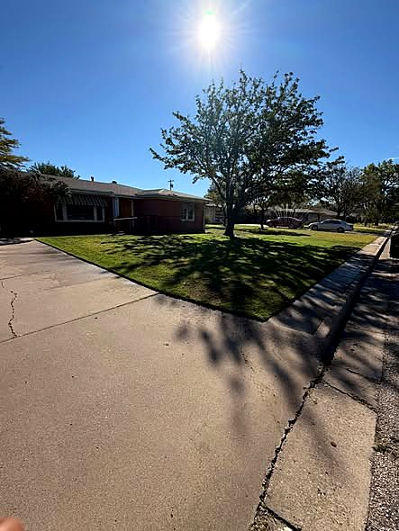 Freshly edged suburban lawn by Hussein Lawn Care